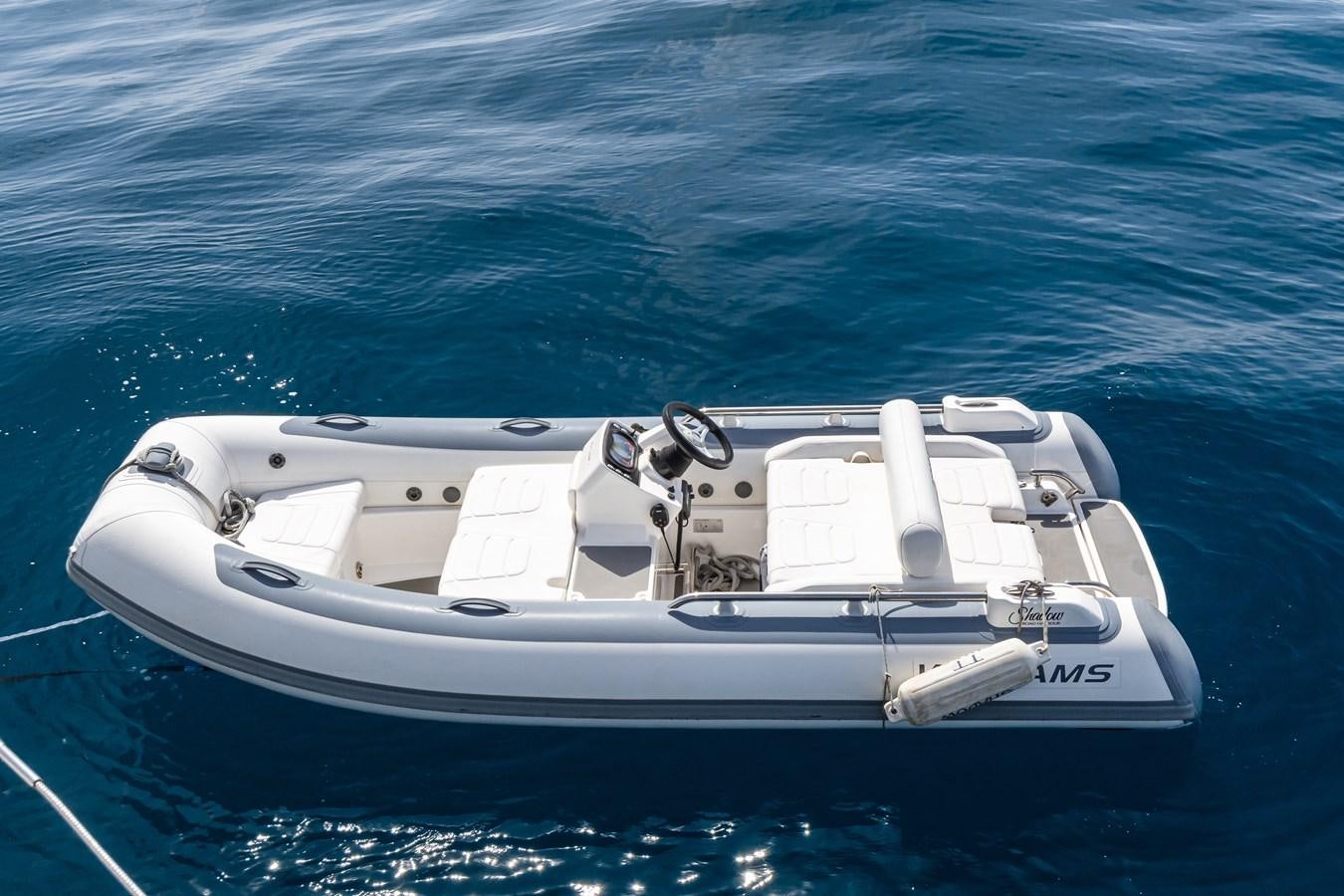 a white boat in the water aboard SHADOW Yacht for Sale