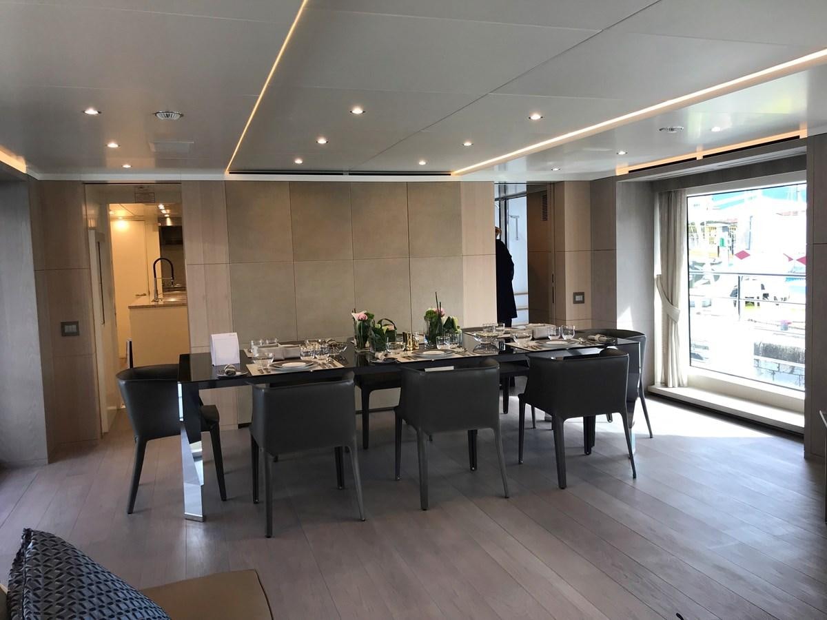 a large kitchen with a table and chairs aboard ALEGRE Yacht for Charter