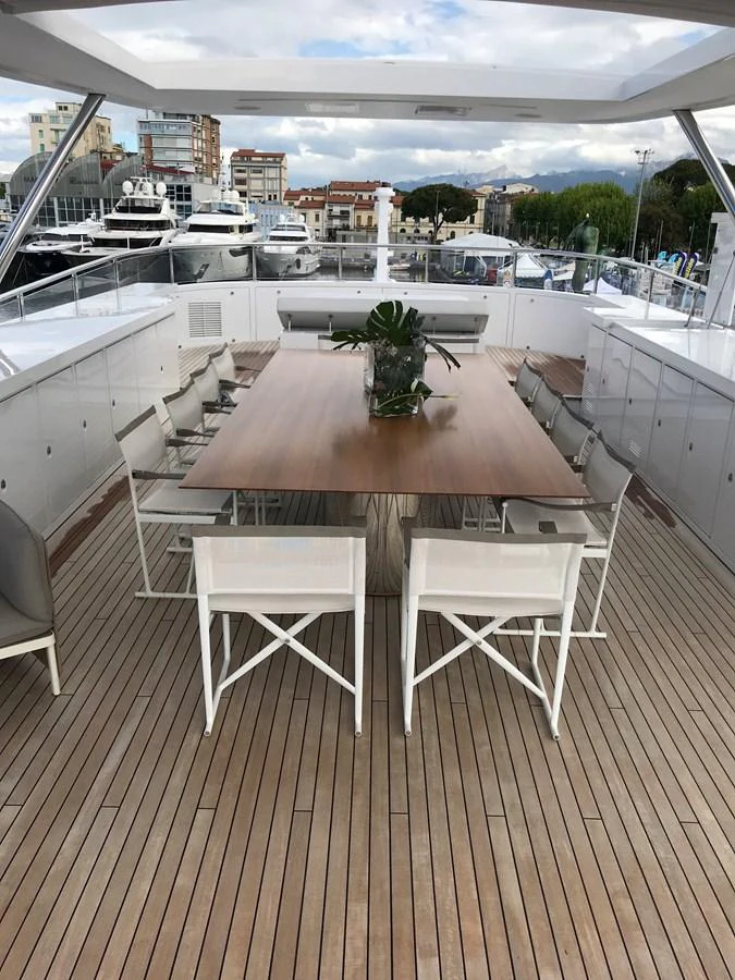a table on a deck aboard SEVEN Yacht for Sale