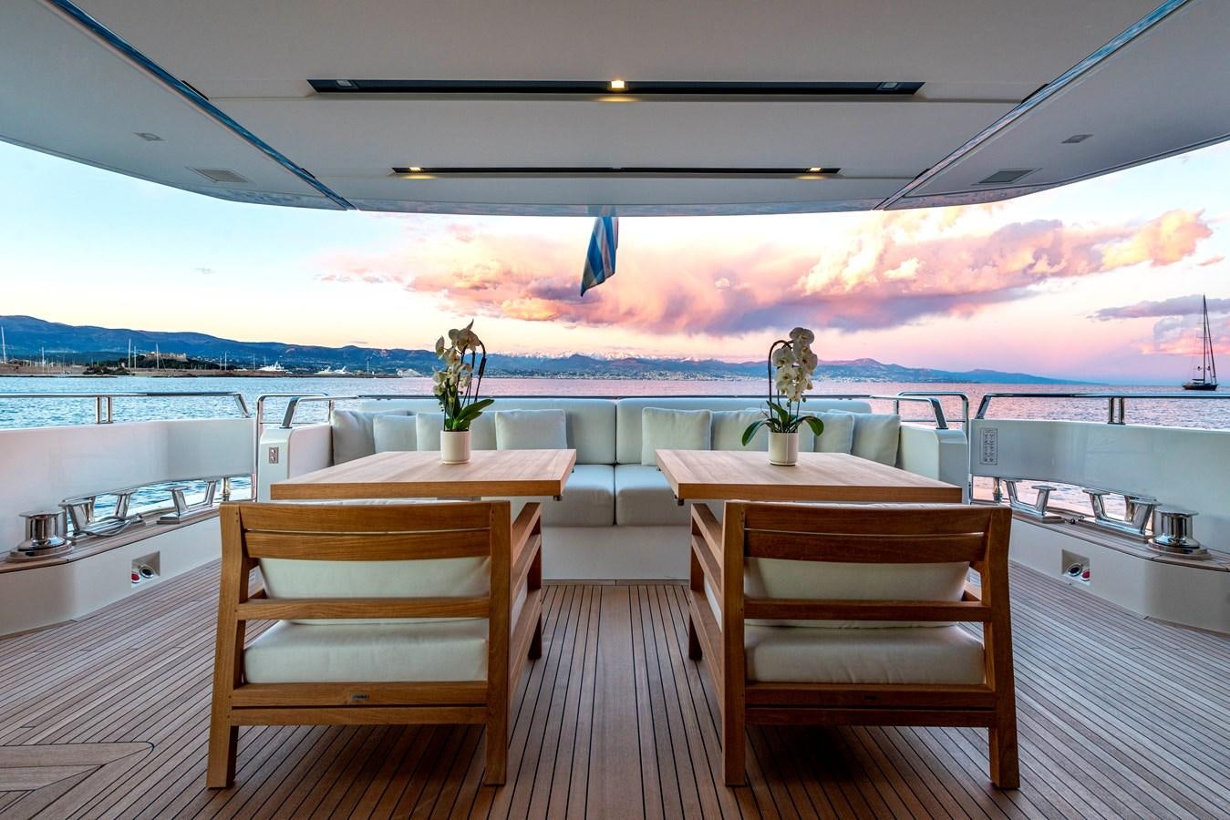 a room with a table and chairs aboard AMWAJ Yacht for Sale