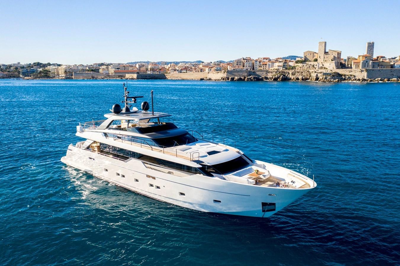 a white yacht in the water aboard AMWAJ Yacht for Sale