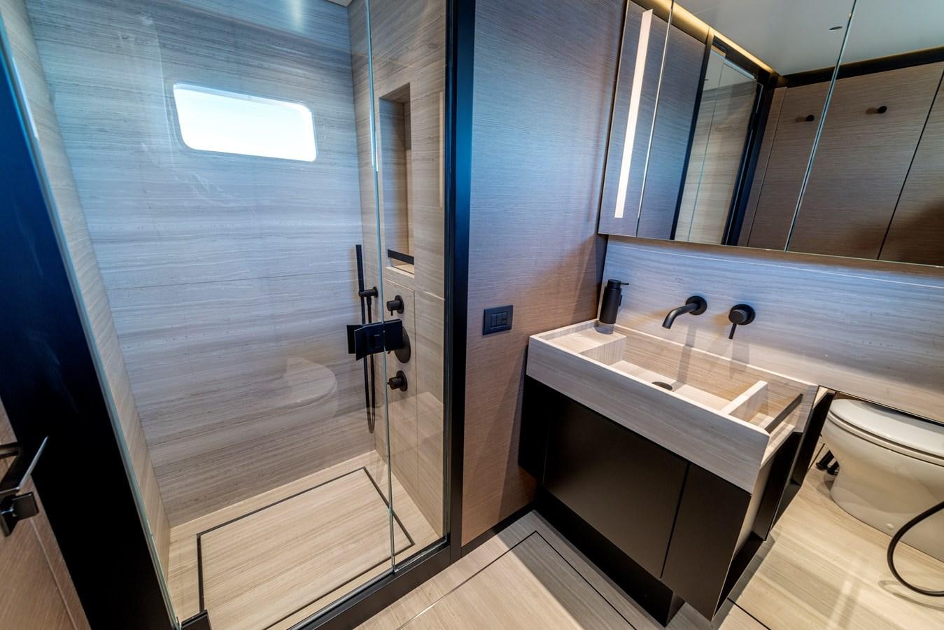 a bathroom with a sink and a mirror aboard AMWAJ Yacht for Sale