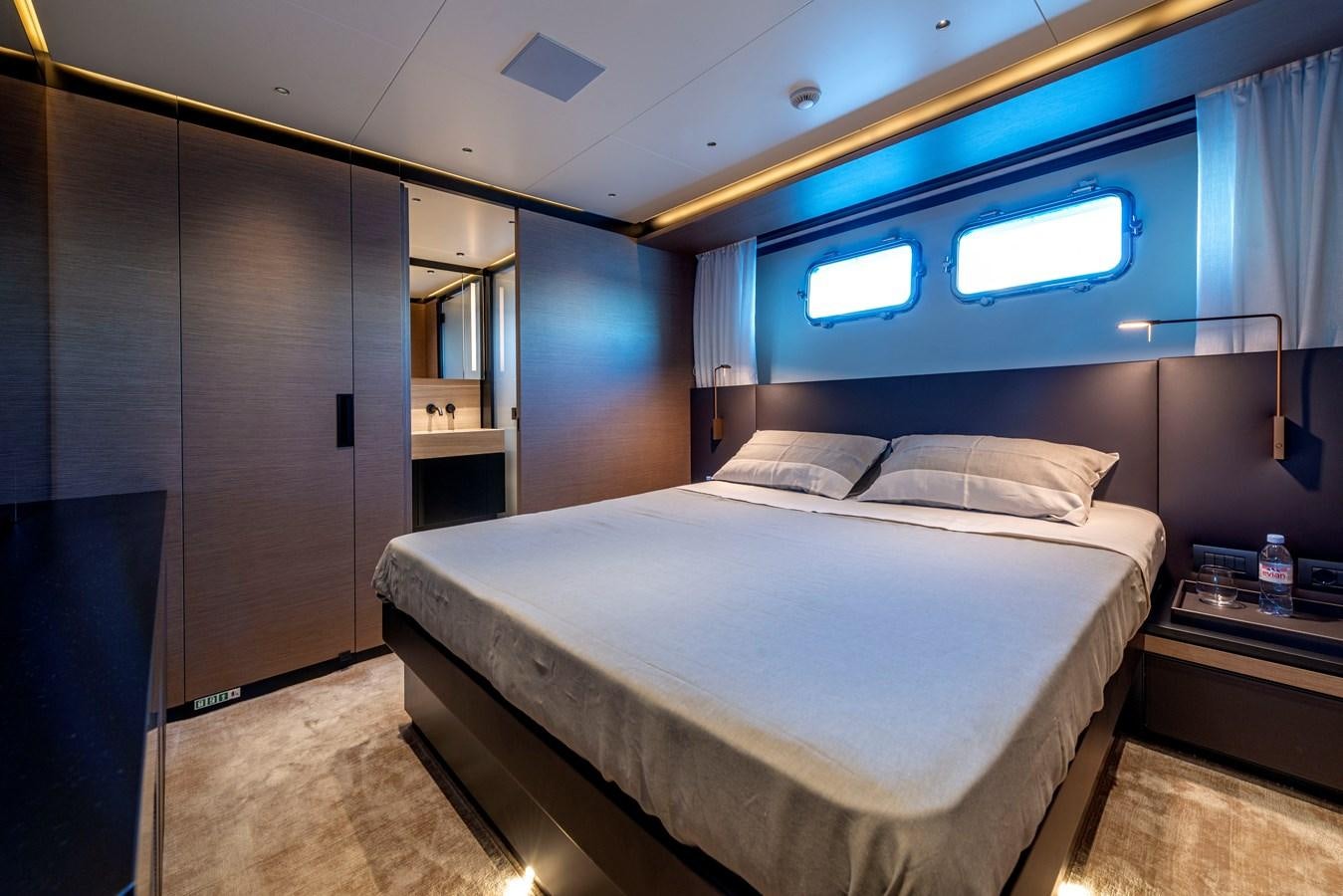 a bed in a room aboard AMWAJ Yacht for Sale