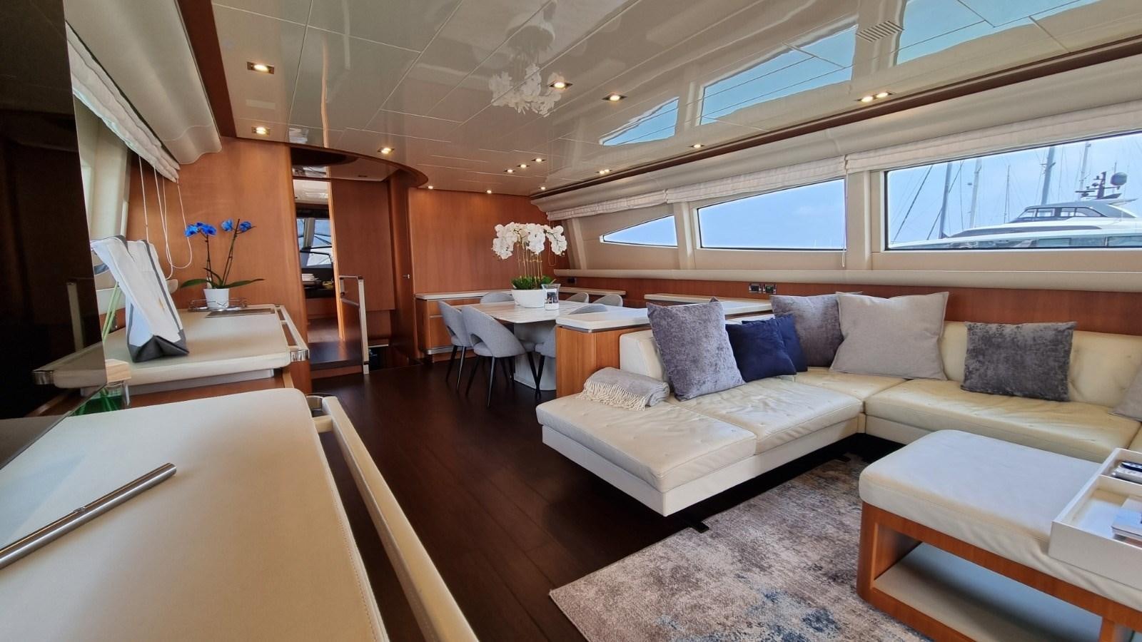 a living room with a couch and a table aboard FTS2 Yacht for Sale