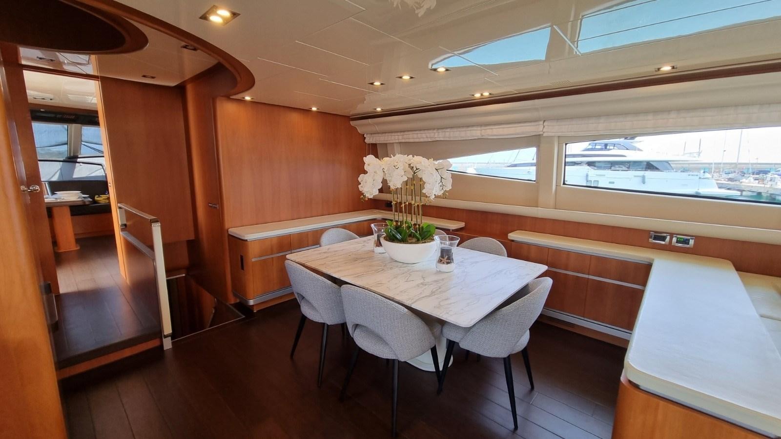a room with a table and chairs aboard FTS2 Yacht for Sale