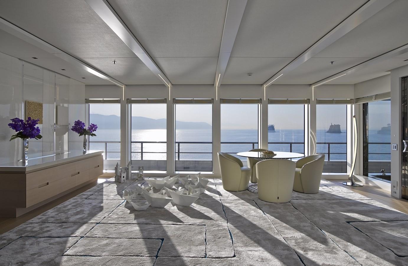 a room with large windows aboard STELLA MARIS Yacht for Sale