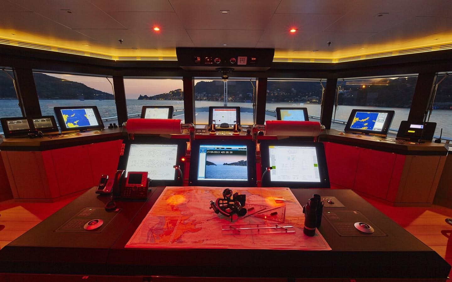 a room with a desk and computer screens aboard STELLA MARIS Yacht for Sale