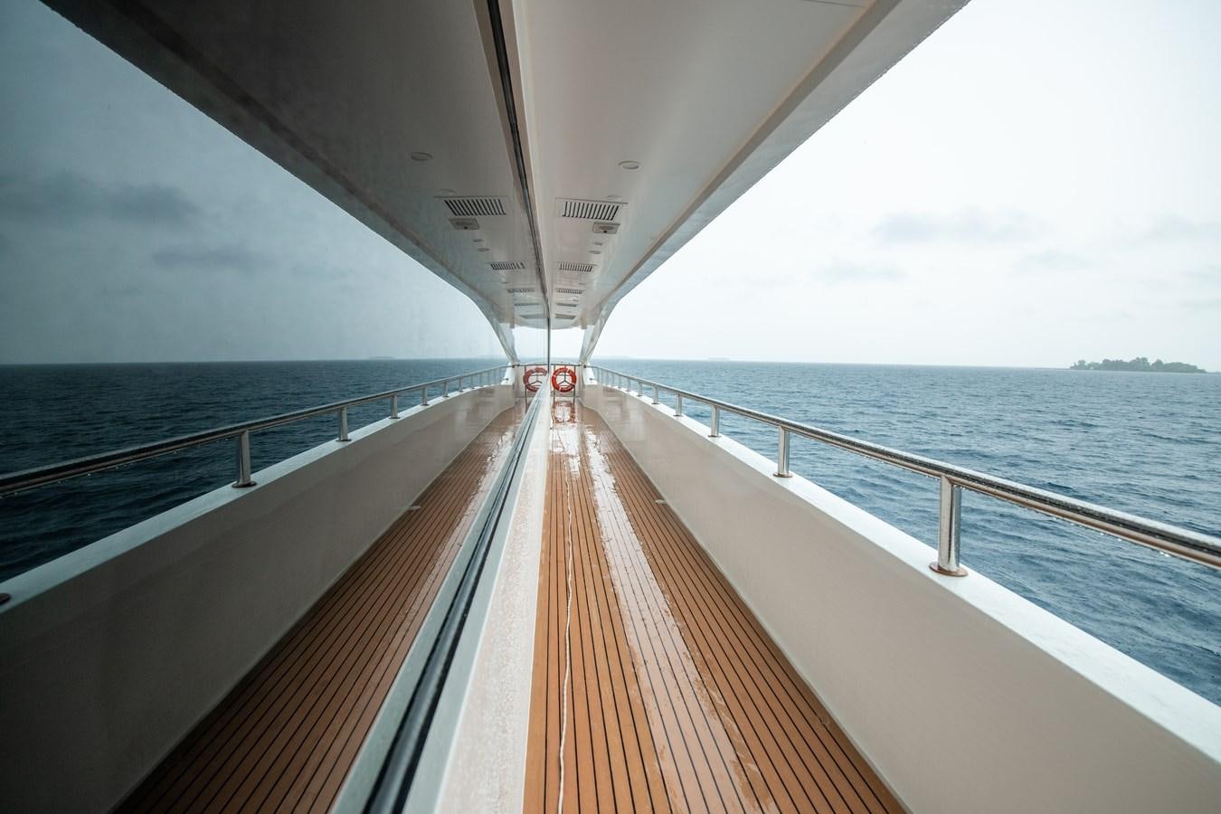 a long wooden dock over water aboard INFINITY X Yacht for Sale