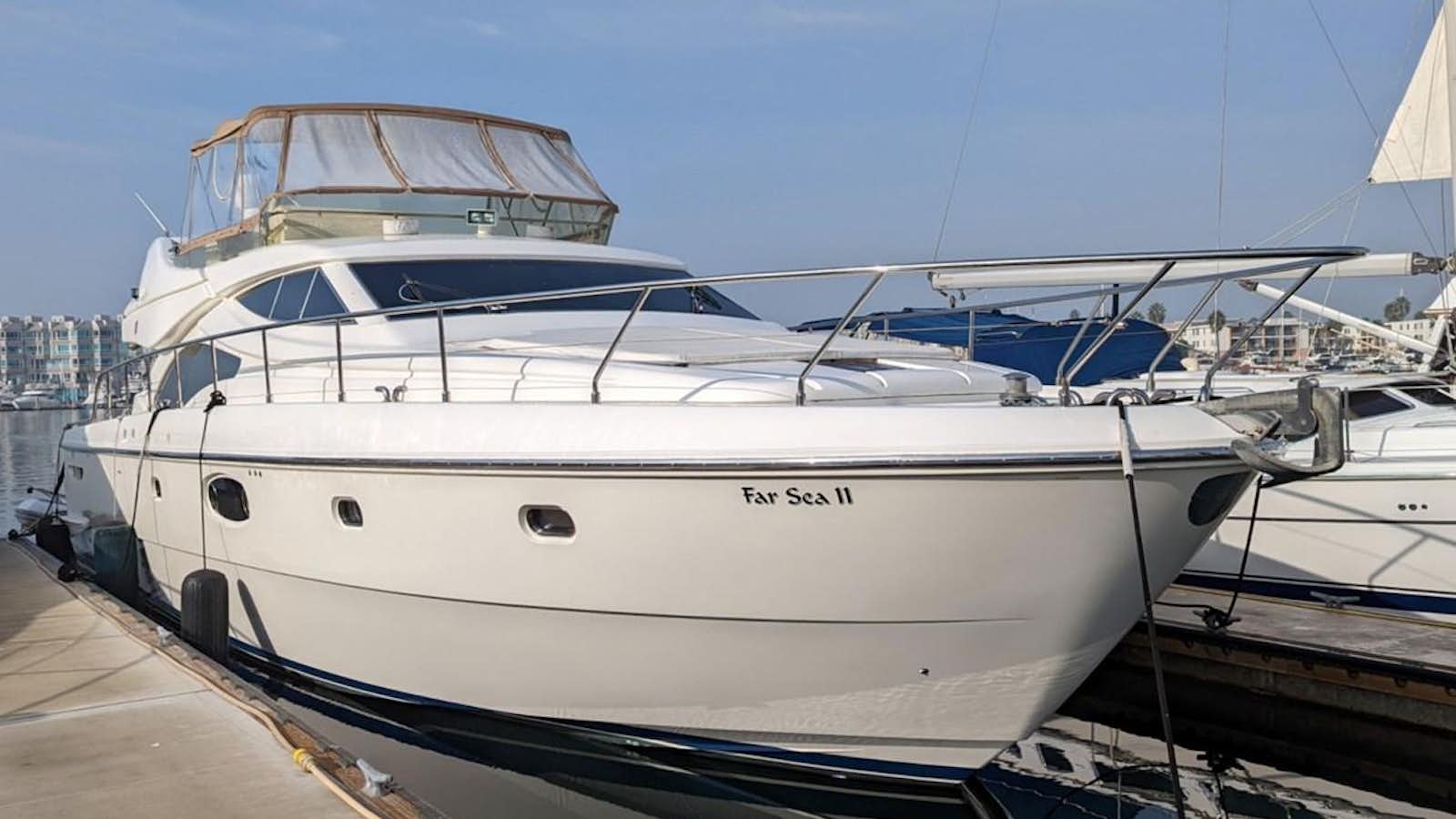 a group of boats are parked in a harbor aboard FAR SEA II Yacht for Sale