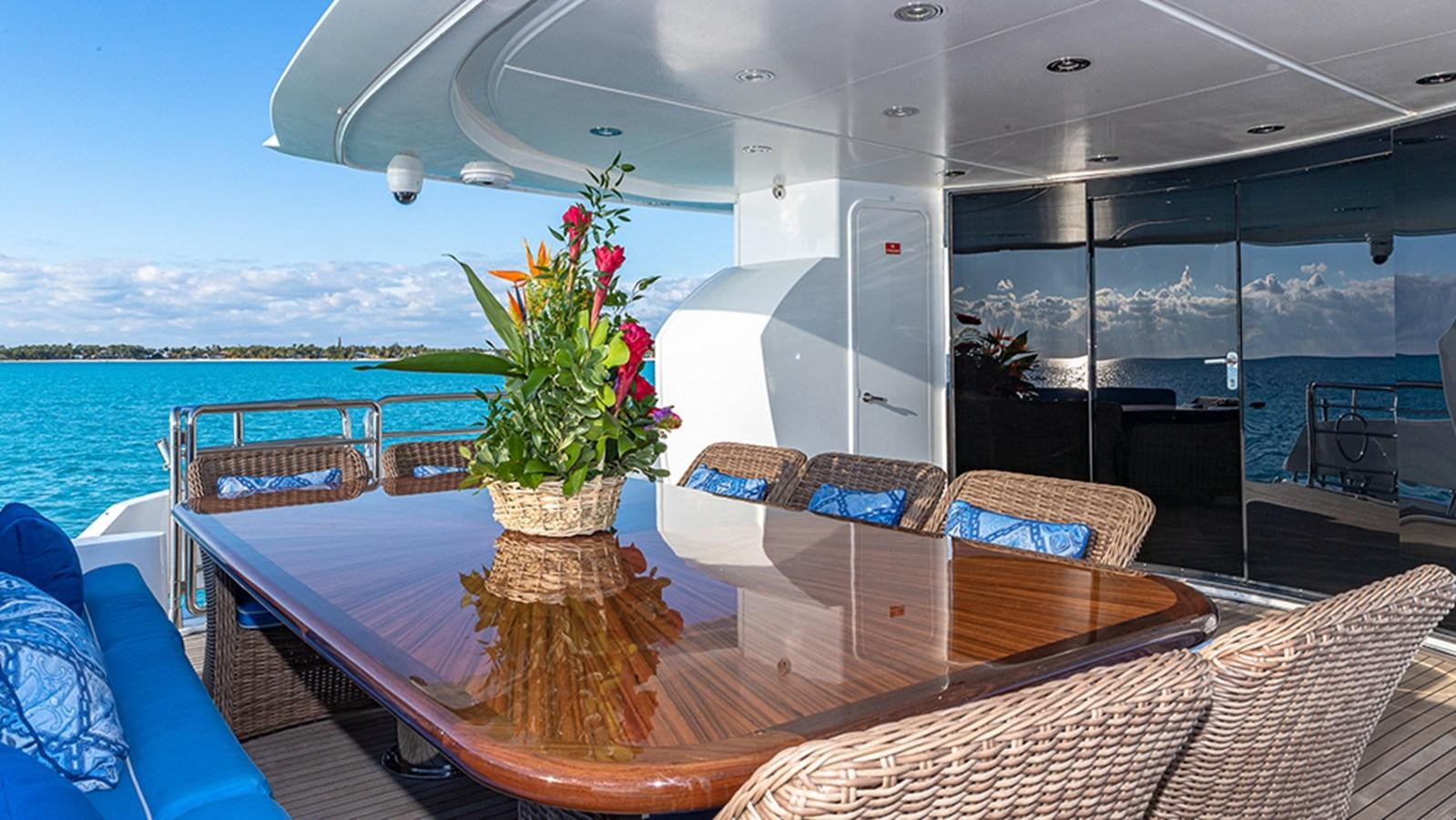 a table with a plant on it aboard KEFI Yacht for Sale