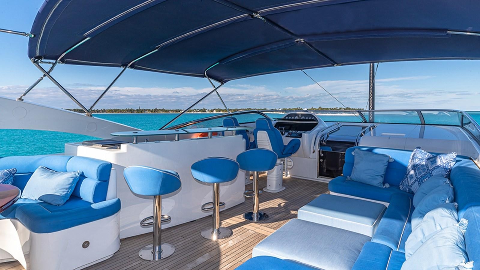 a boat with blue pillows aboard KEFI Yacht for Sale