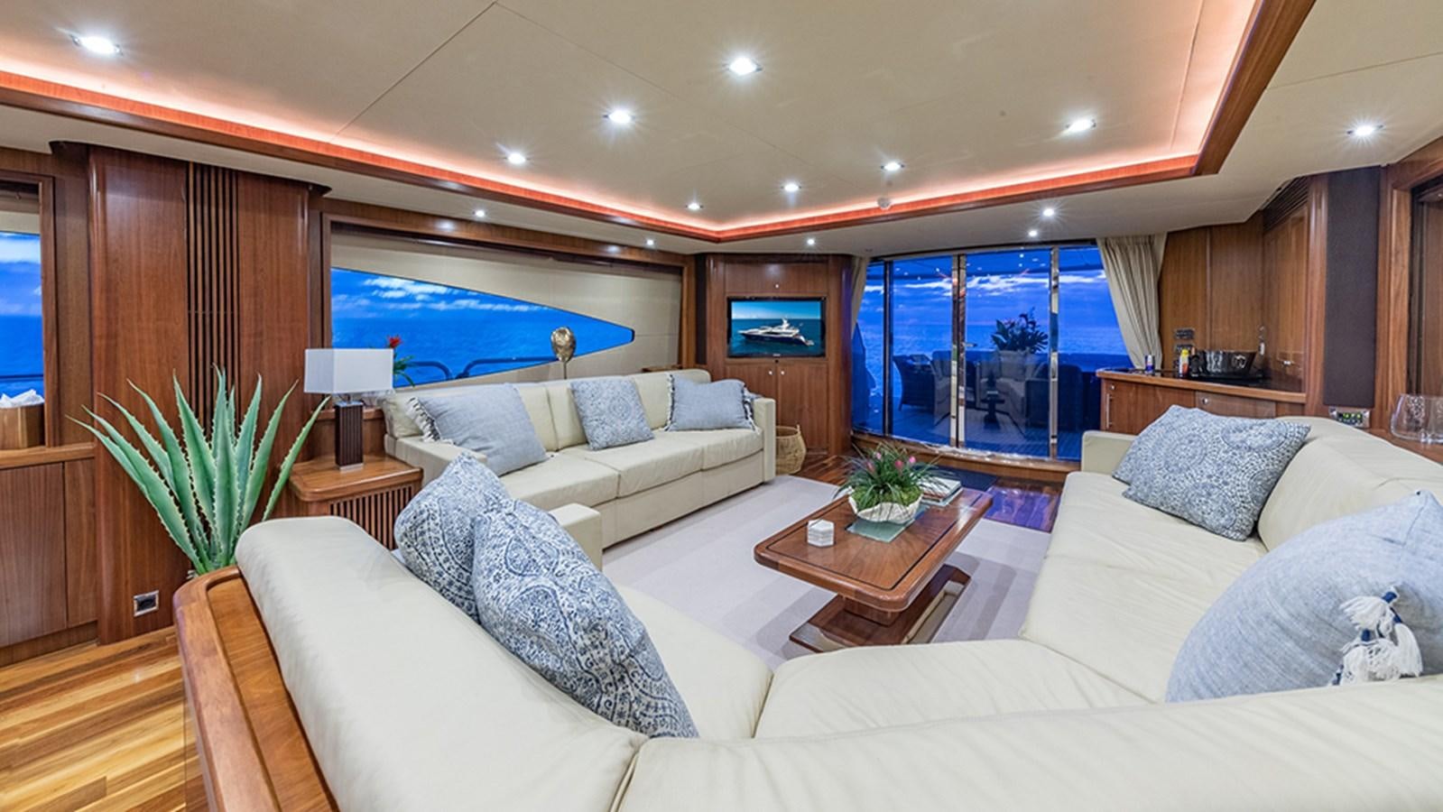 a living room with a large window aboard KEFI Yacht for Sale