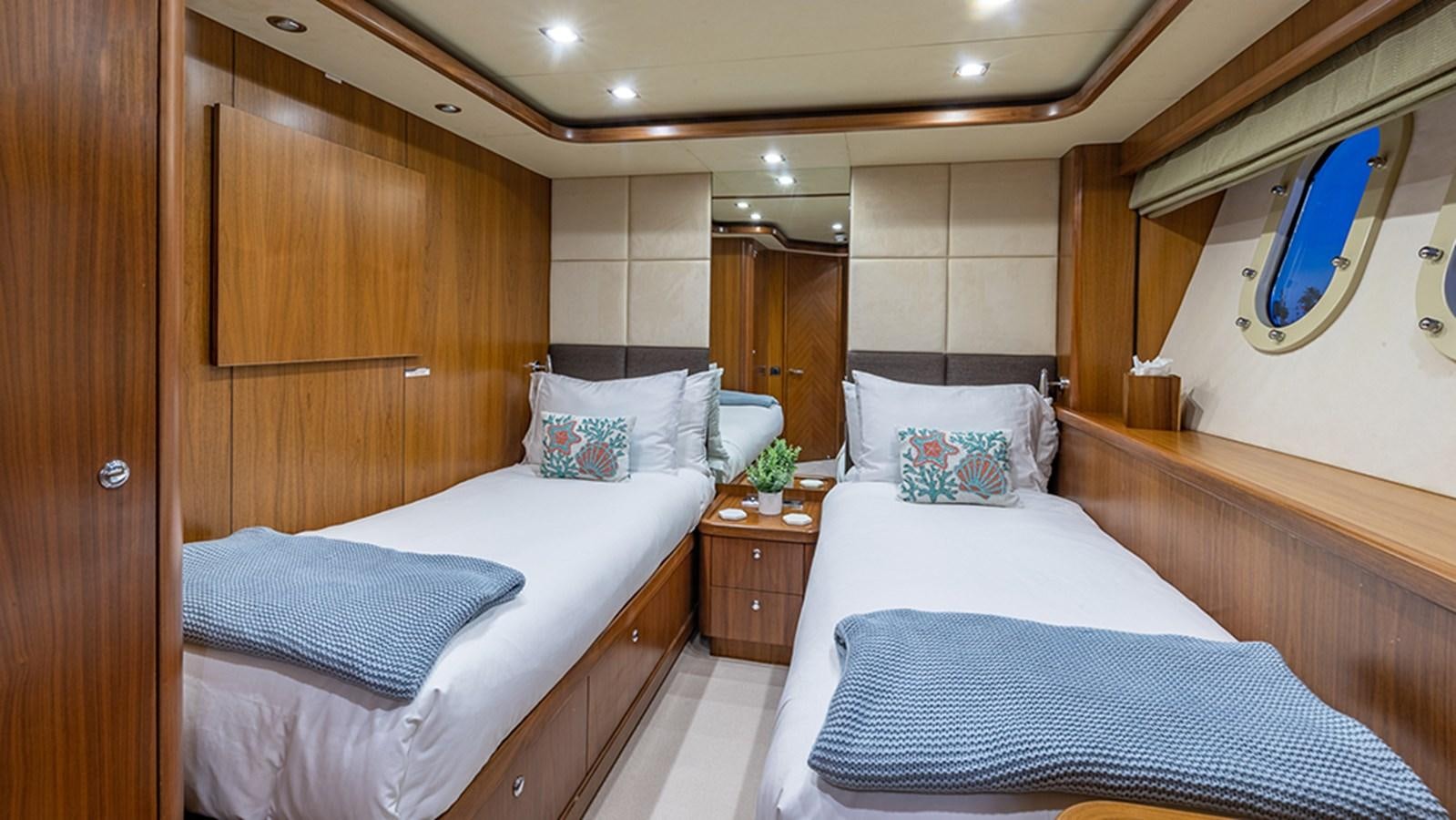 a room with two beds aboard KEFI Yacht for Sale
