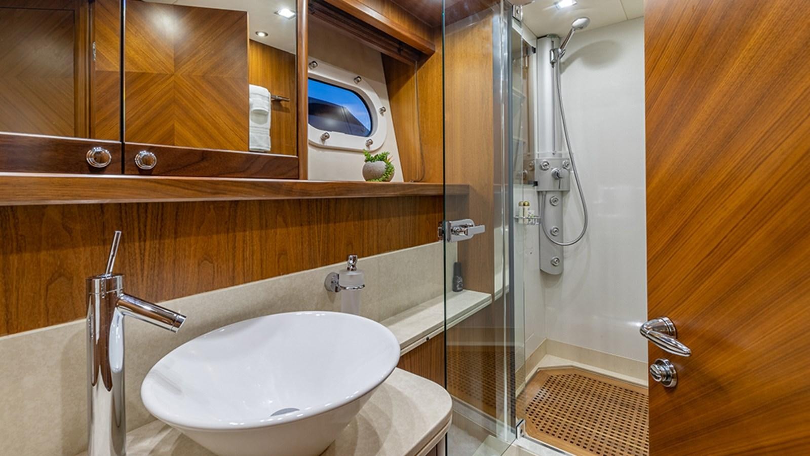 a bathroom with a sink and a shower aboard KEFI Yacht for Sale
