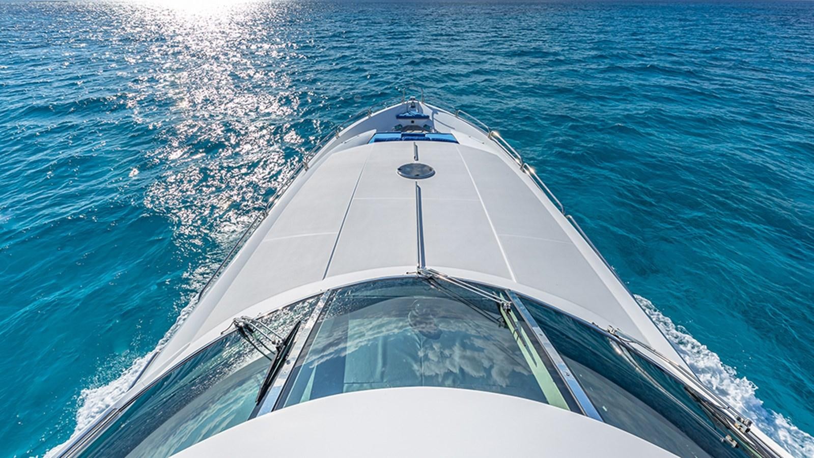 a white boat in the water aboard KEFI Yacht for Sale