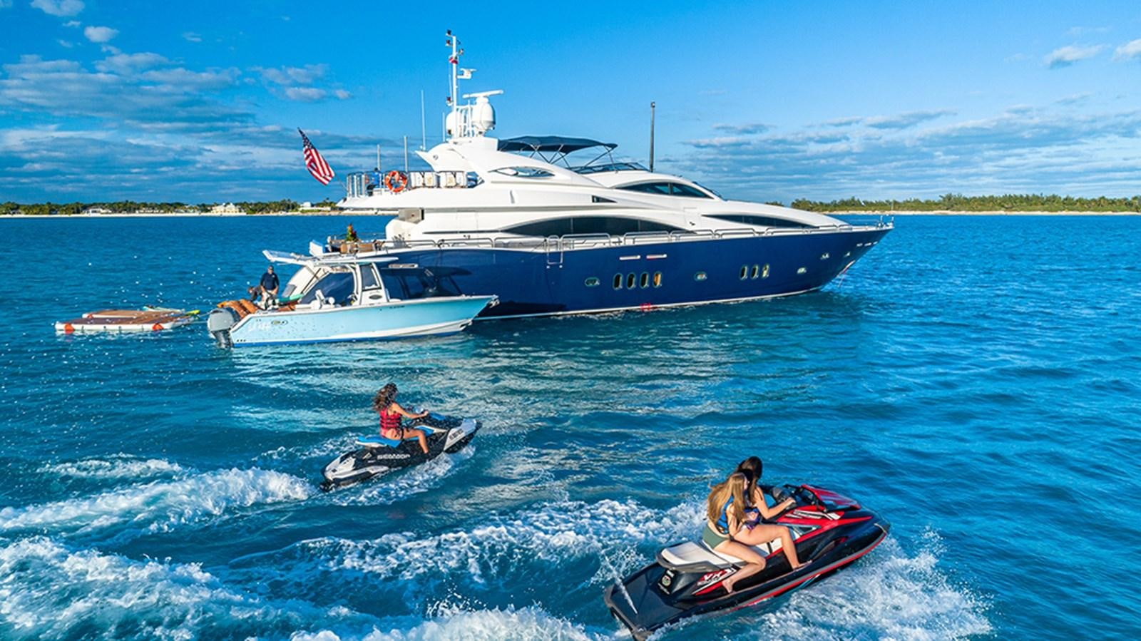 a boat and a couple of people in a motor boat aboard KEFI Yacht for Sale
