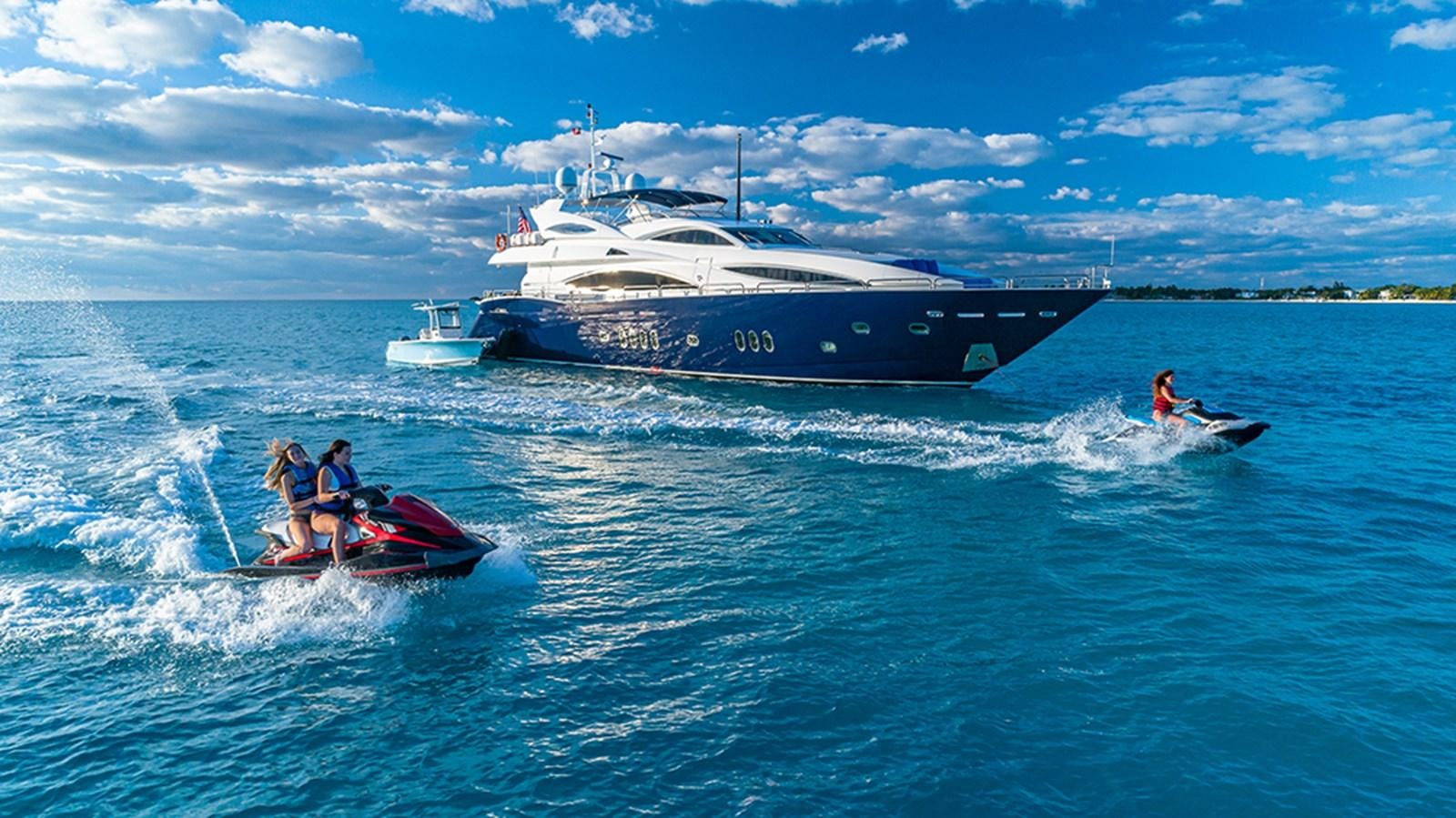 a boat and a couple of people on the water aboard KEFI Yacht for Sale