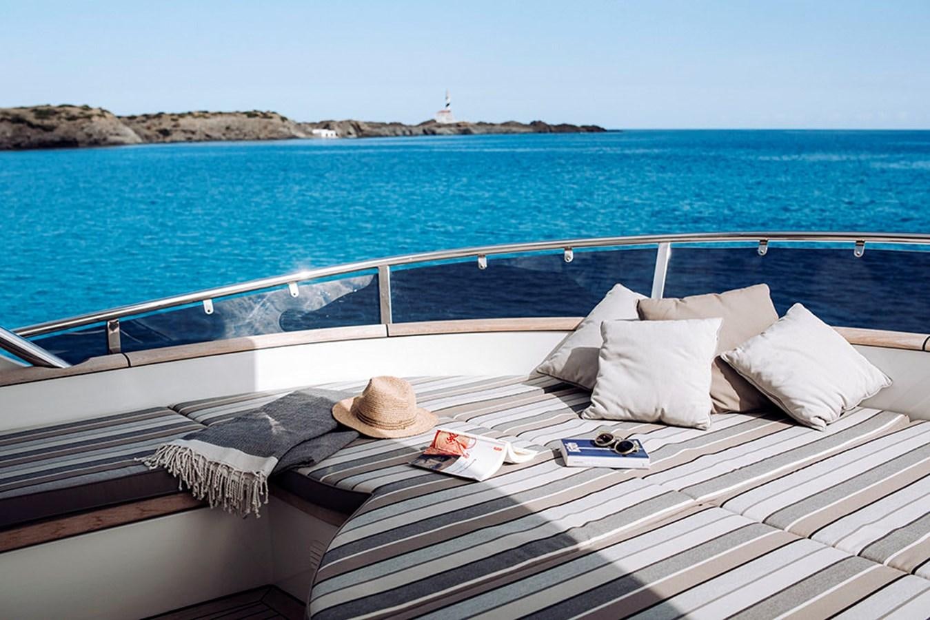 a bed with pillows on it aboard LAS NINAS Yacht for Sale