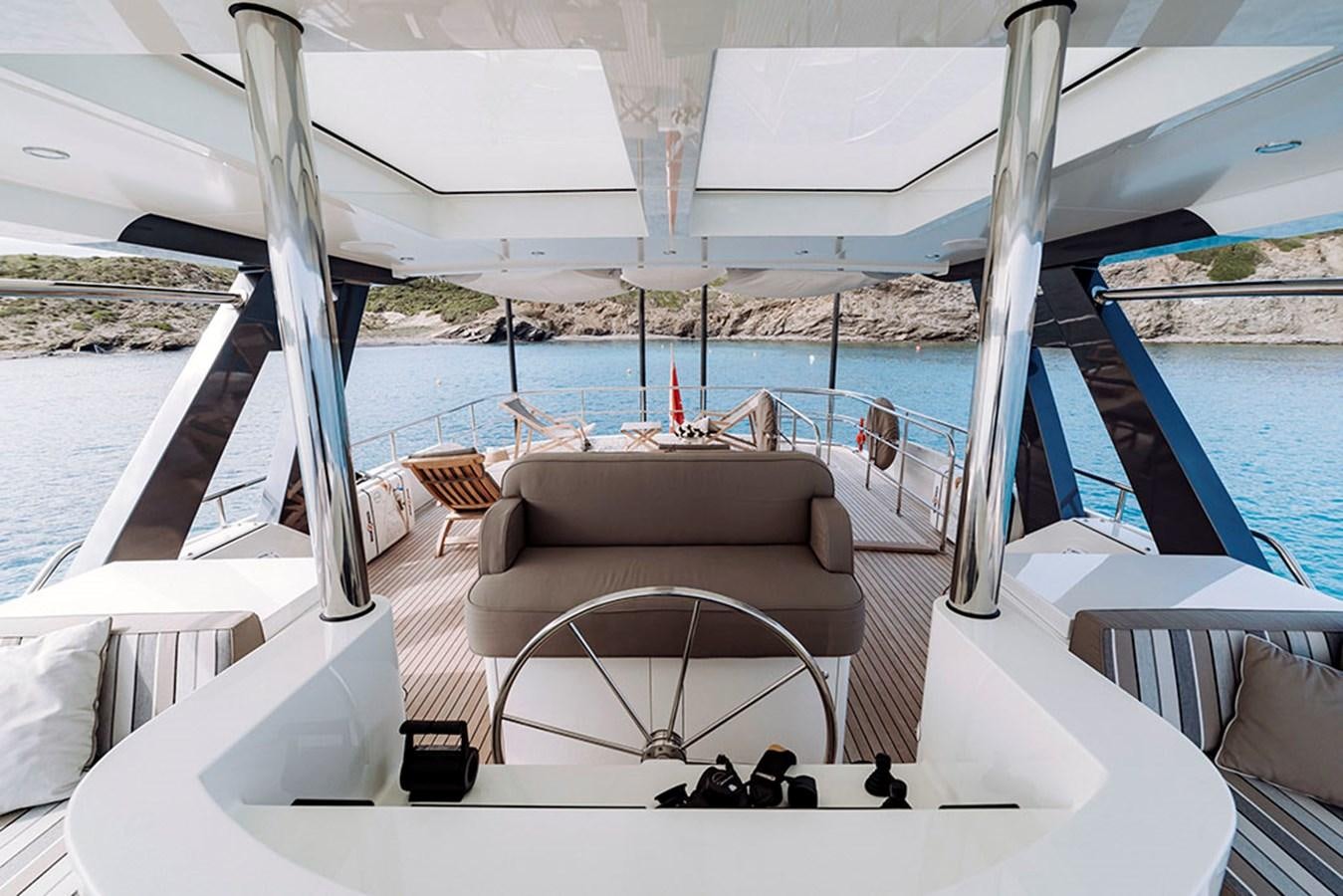 a lounge chair on a boat aboard LAS NINAS Yacht for Sale