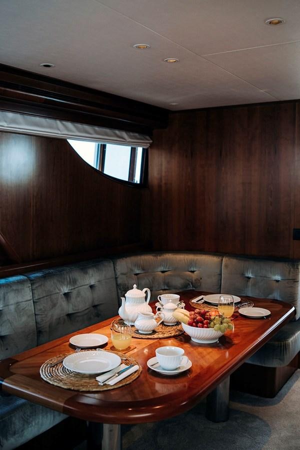 a table with plates and food on it aboard LAS NINAS Yacht for Sale