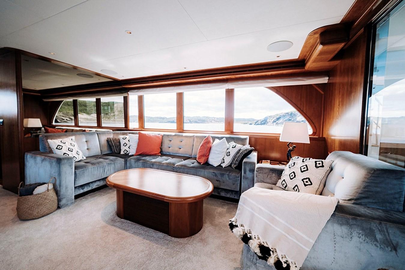 a living room with a large bed aboard LAS NINAS Yacht for Sale