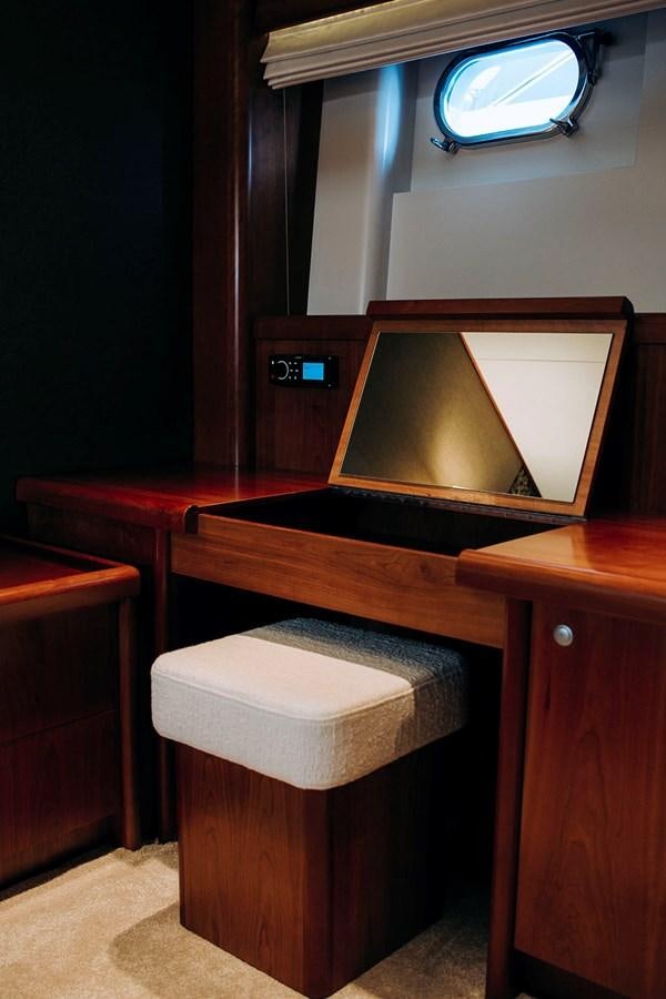 a tv on a table aboard LAS NINAS Yacht for Sale