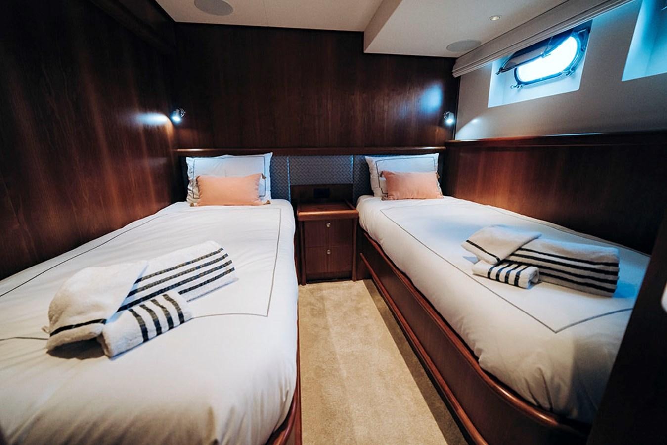 a room with two beds aboard LAS NINAS Yacht for Sale