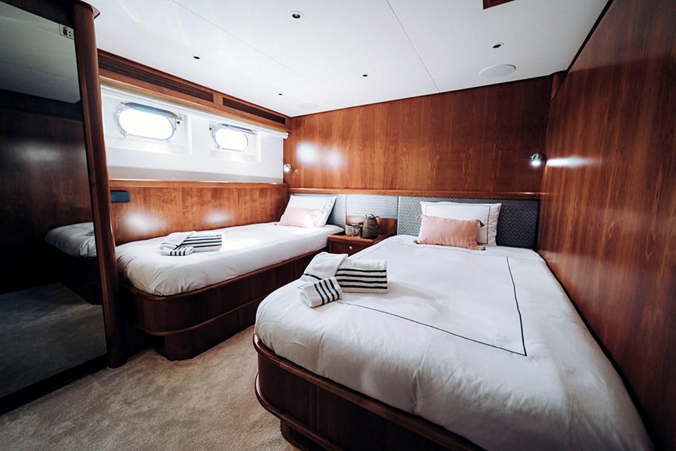 a room with two beds aboard LAS NINAS Yacht for Sale