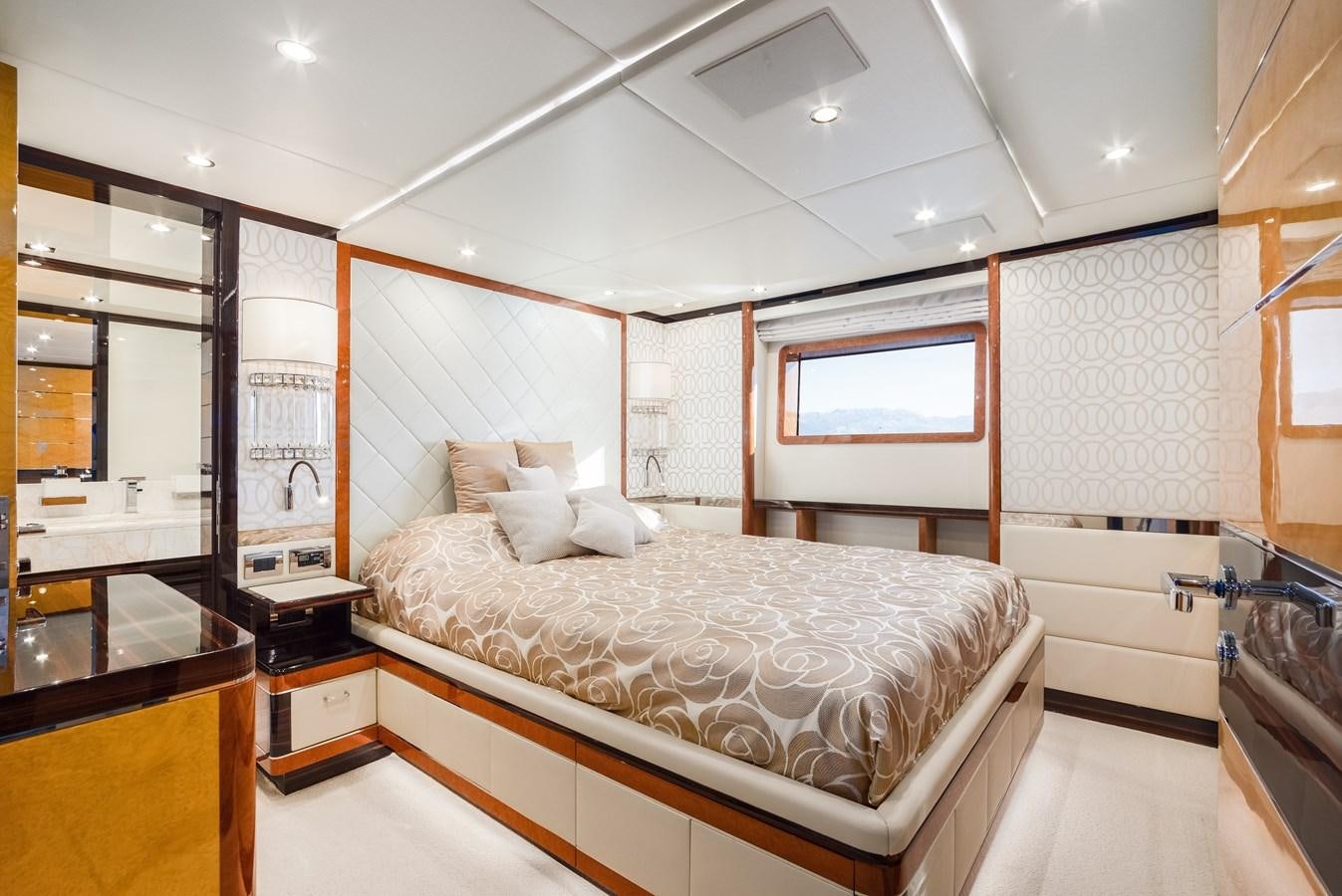 a bedroom with a large bed aboard VARVARA Yacht for Sale