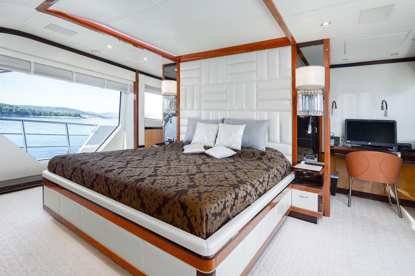 a large bed in a room aboard VARVARA Yacht for Sale