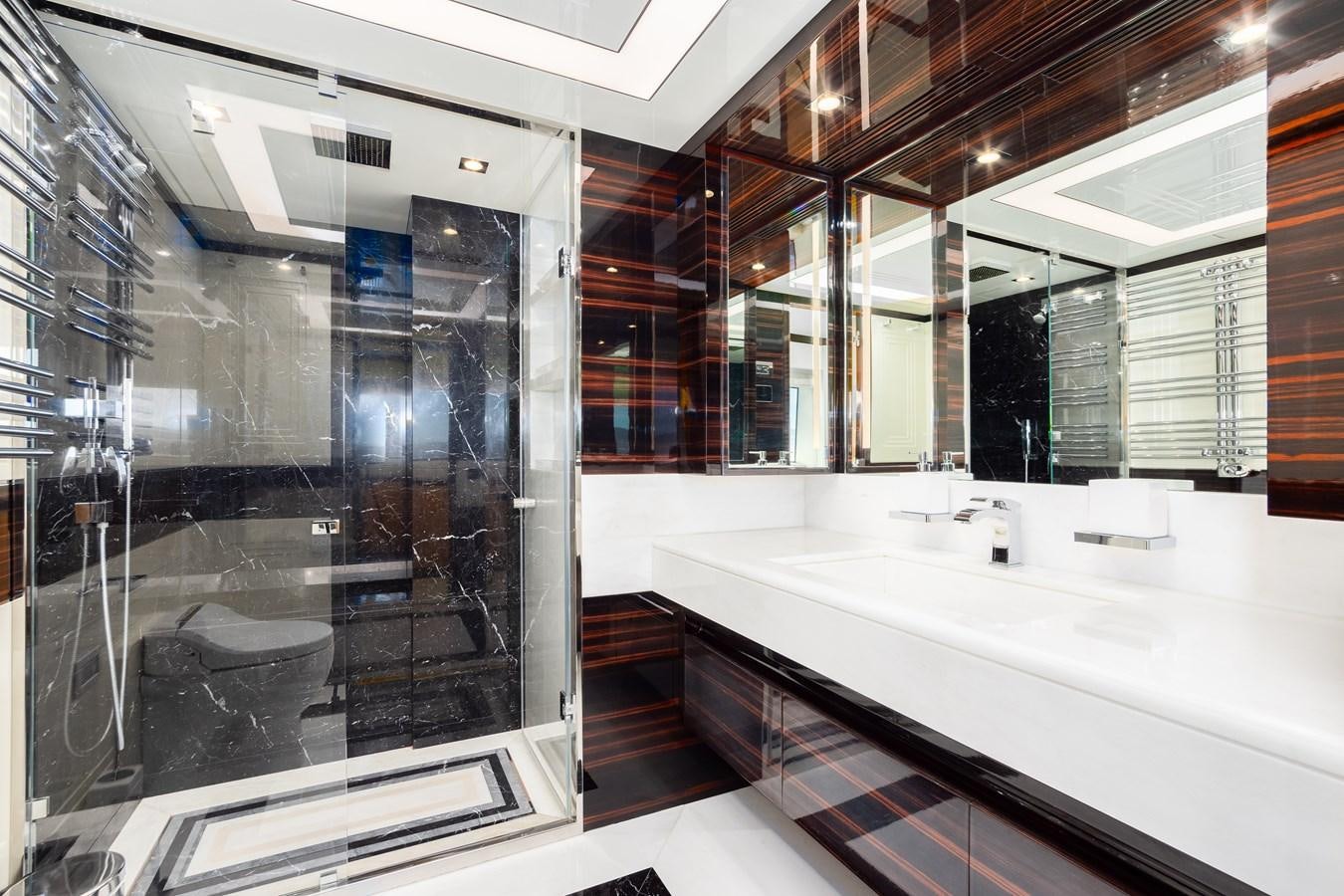 a bathroom with a large glass shower aboard VARVARA Yacht for Sale