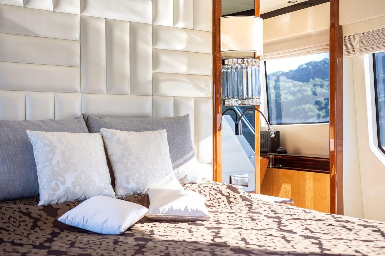 a bed with white pillows aboard VARVARA Yacht for Sale