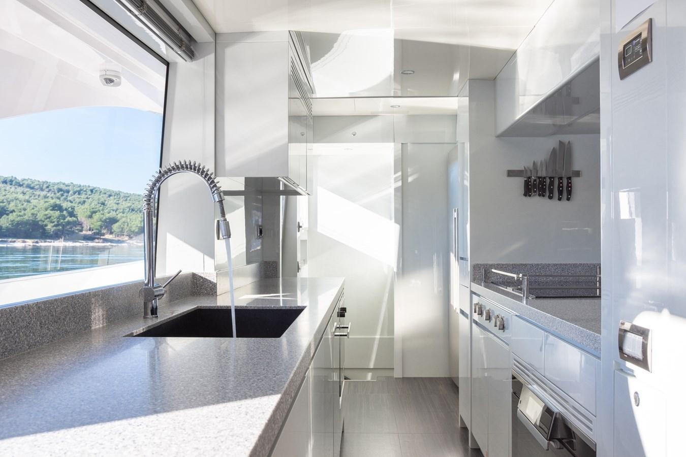 a room with a large window and a view of the water aboard VARVARA Yacht for Sale