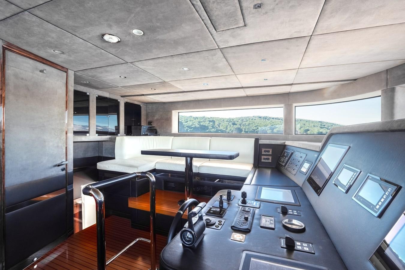 a room with a table and chairs aboard VARVARA Yacht for Sale