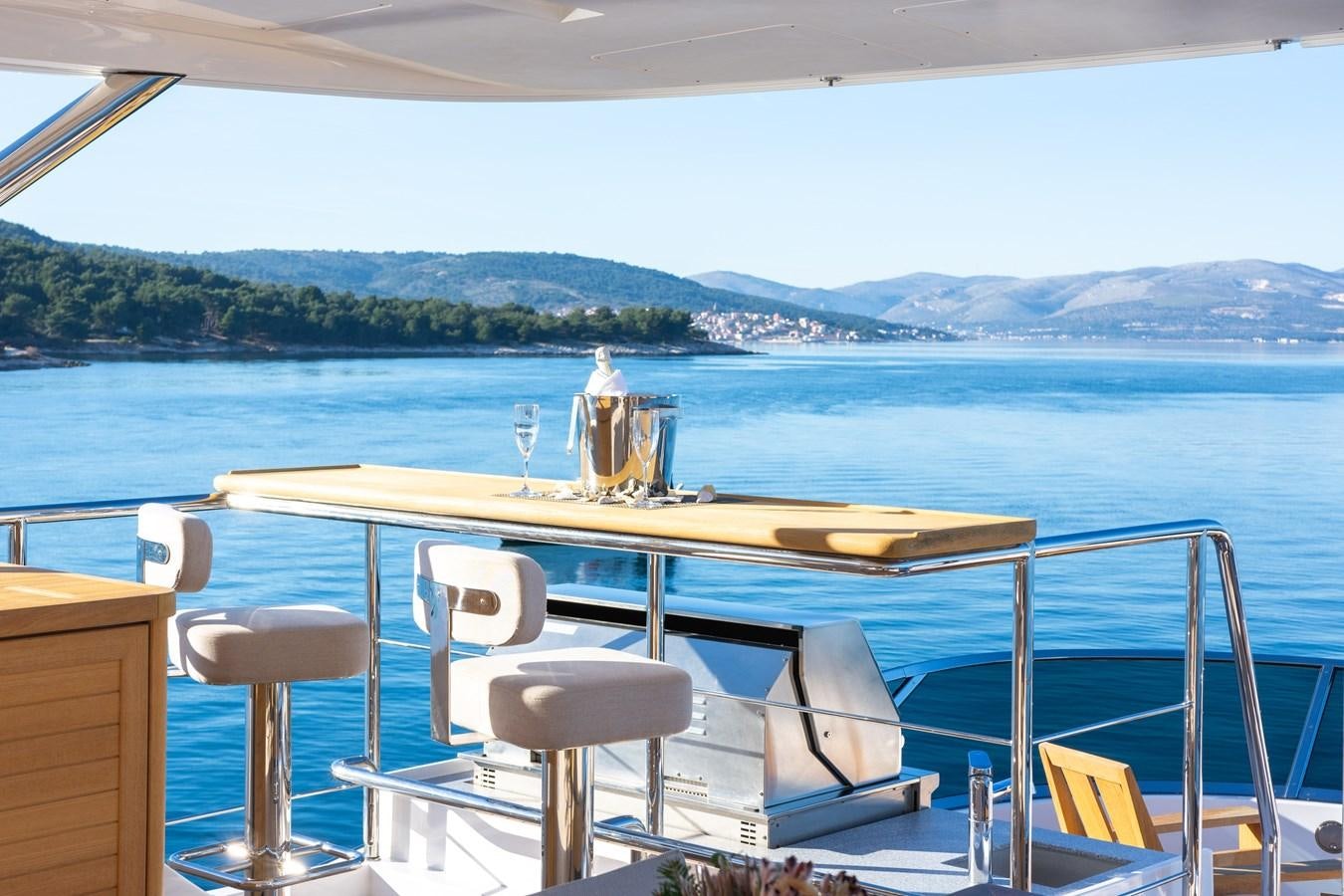 a table and chairs on a boat aboard VARVARA Yacht for Sale