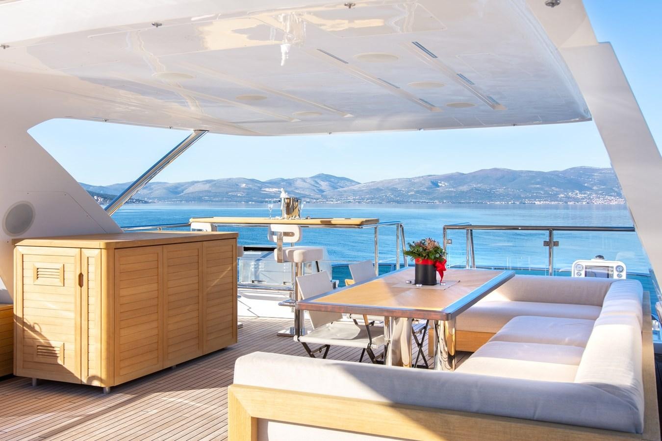 a room with a table and chairs aboard VARVARA Yacht for Sale