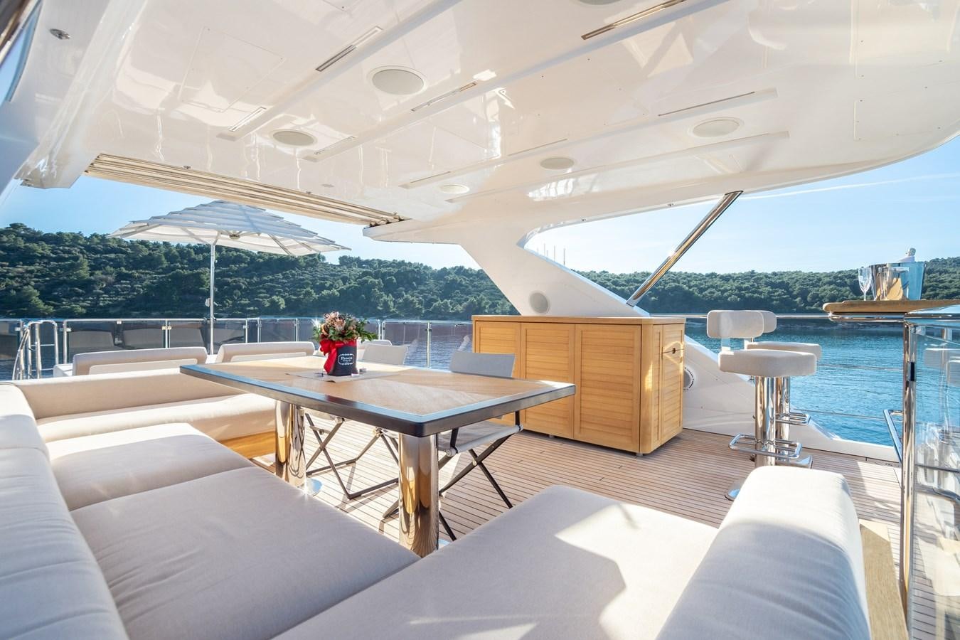 a room with a table and chairs aboard VARVARA Yacht for Sale