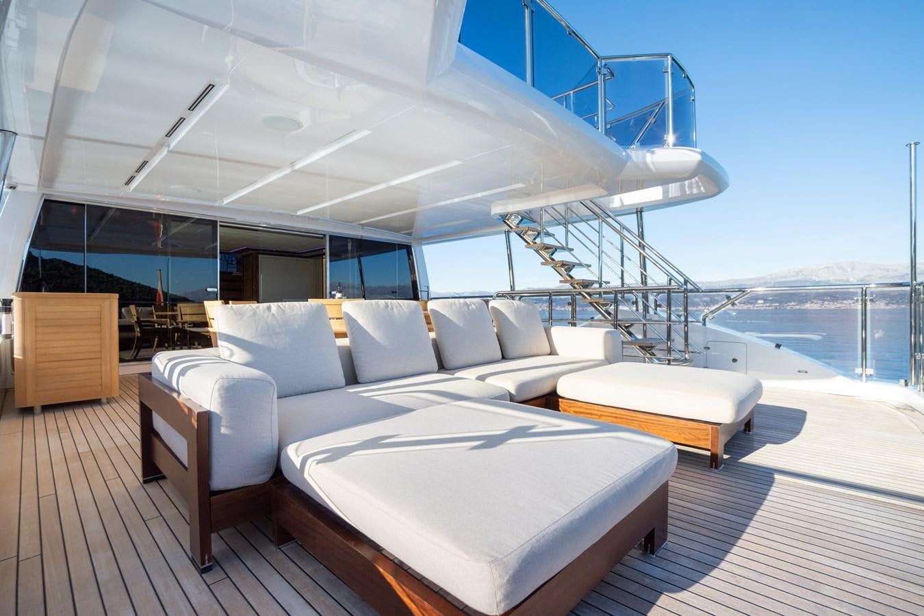 a large white bed on a deck aboard VARVARA Yacht for Sale