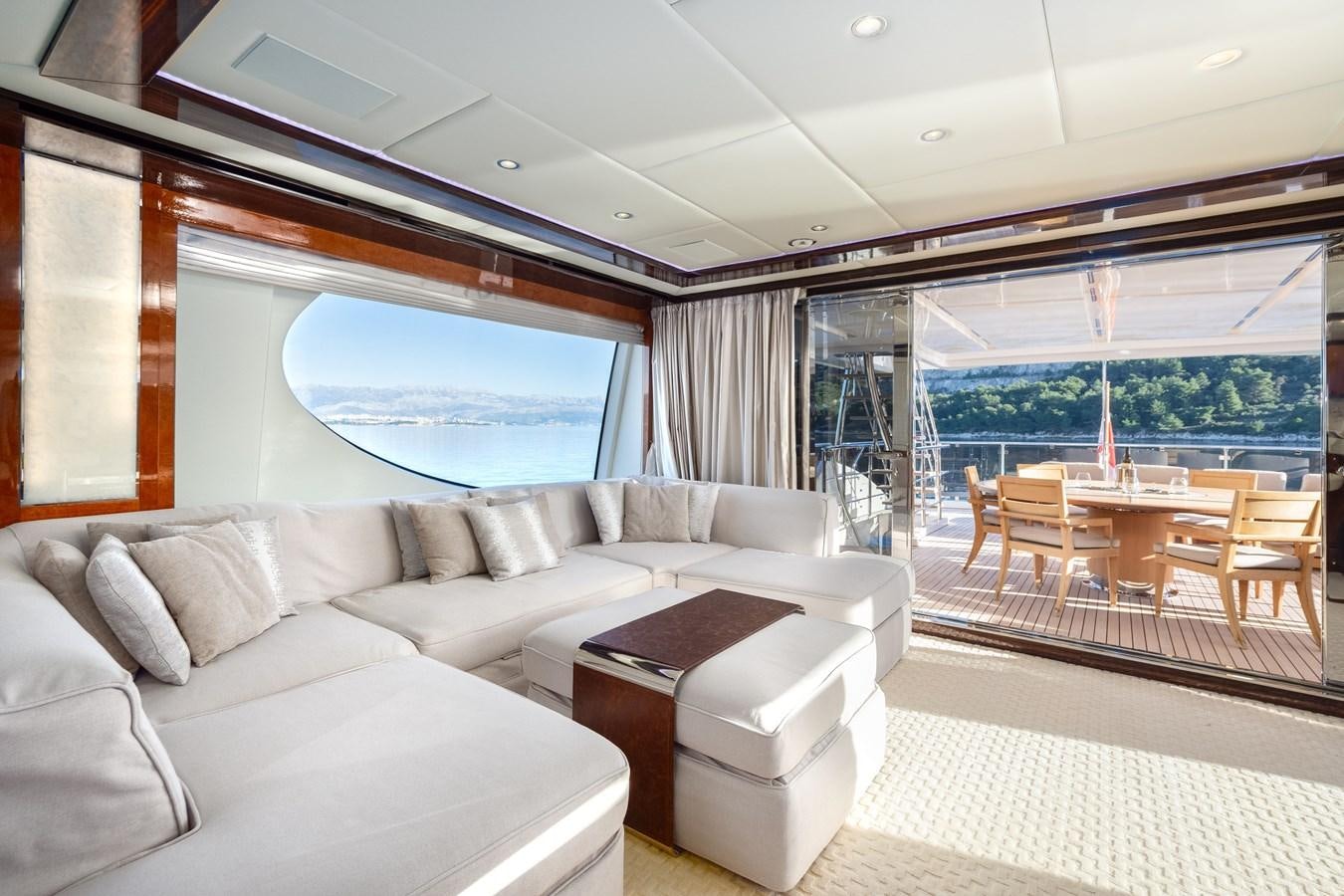 a living room with a large window aboard VARVARA Yacht for Sale