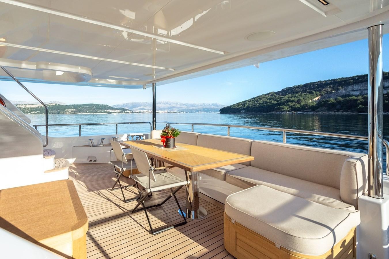 a room with a table and chairs aboard VARVARA Yacht for Sale
