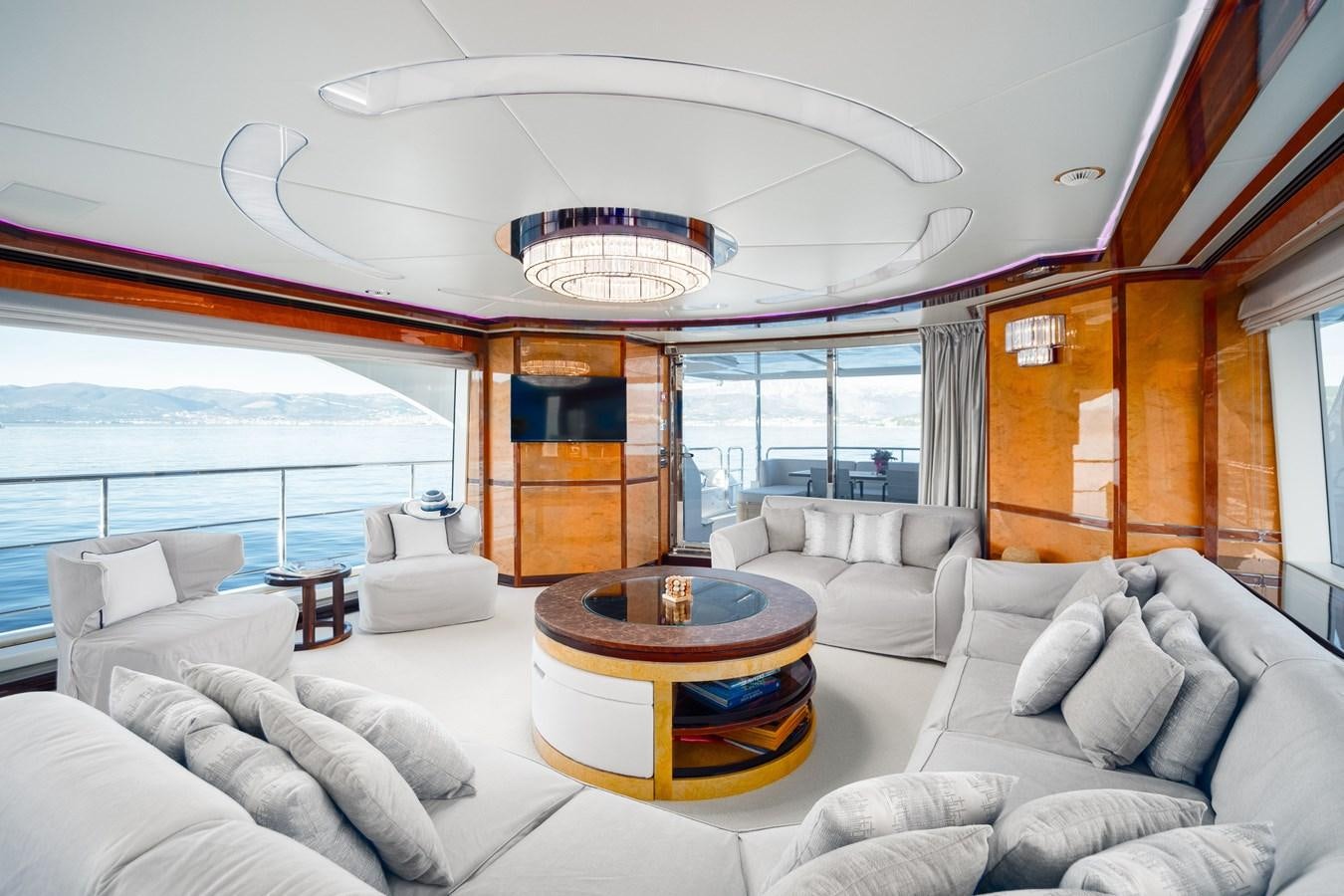 a living room with a large window aboard VARVARA Yacht for Sale