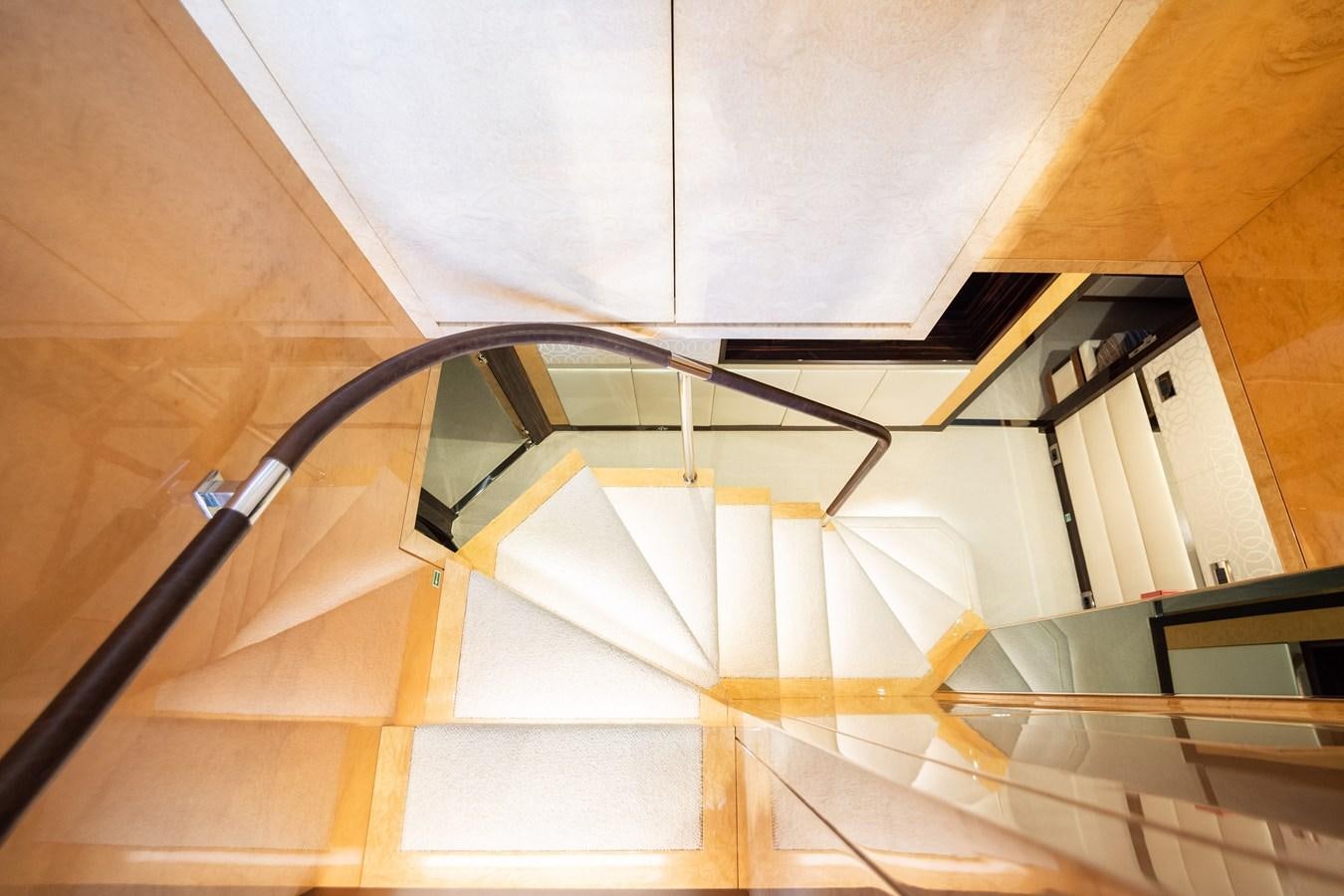 a spiral staircase with a spiral staircase aboard VARVARA Yacht for Sale