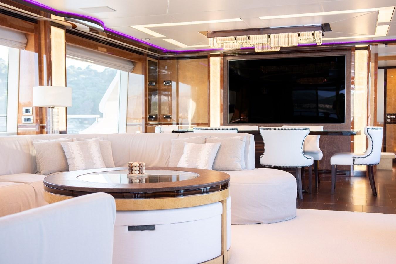 a room with a table and chairs aboard VARVARA Yacht for Sale