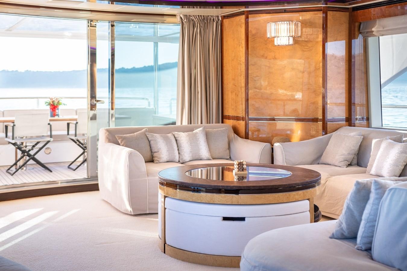 a living room with a large window aboard VARVARA Yacht for Sale