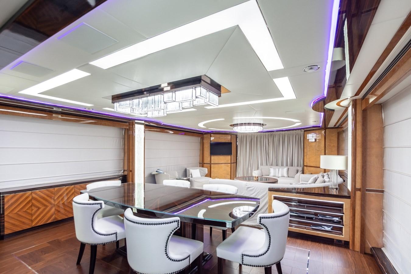 a room with a table and chairs aboard VARVARA Yacht for Sale