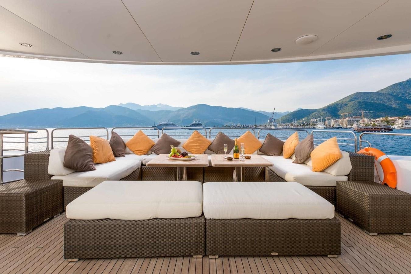 a room with couches and a table and a large body of water aboard BARRACUDA RED SEA Yacht for Sale