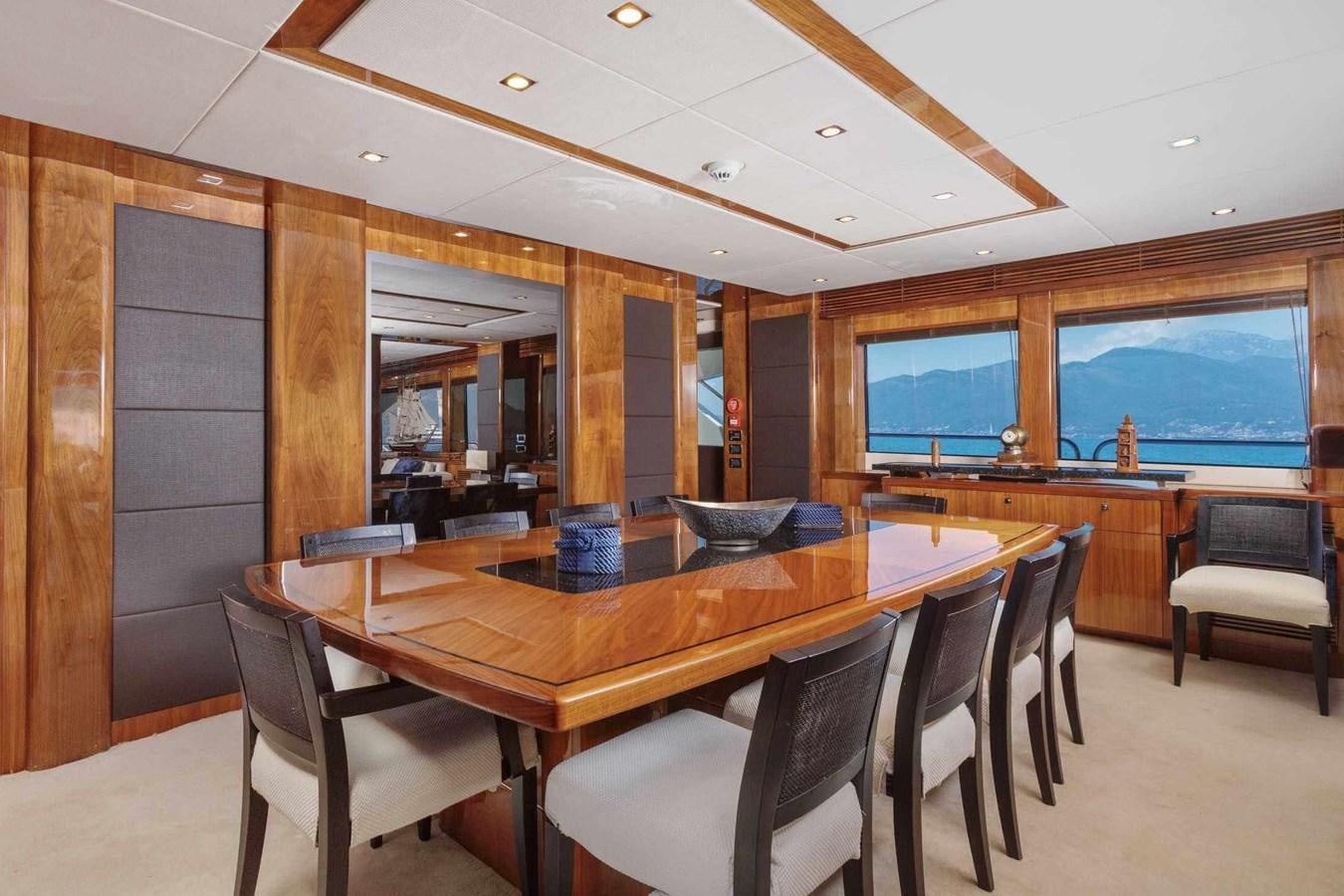 a large dining table in a room aboard BARRACUDA RED SEA Yacht for Sale