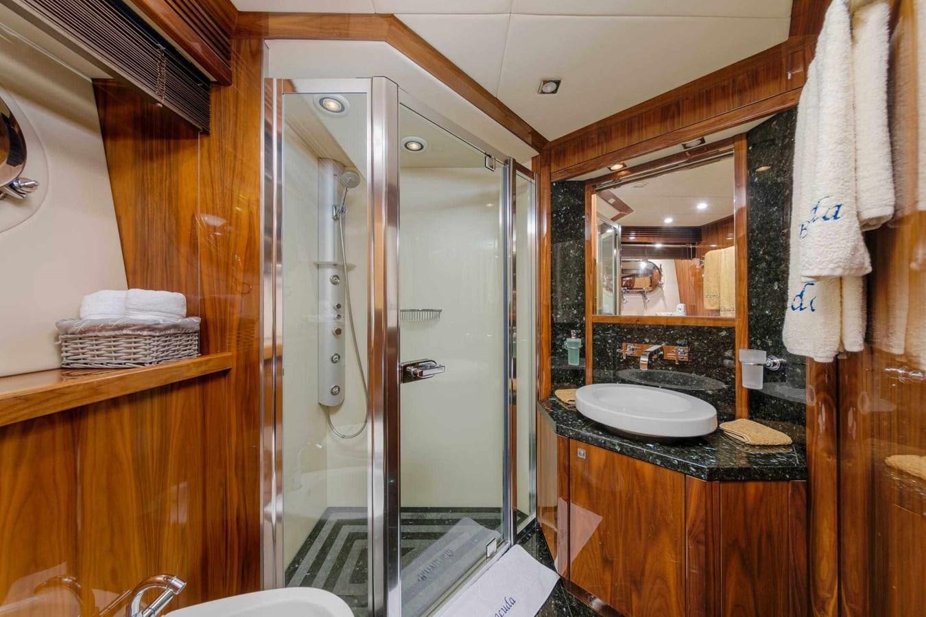 a bathroom with a glass shower aboard BARRACUDA RED SEA Yacht for Sale