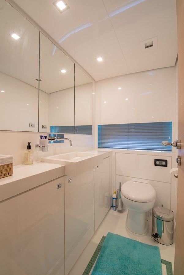 a bathroom with a toilet sink and a mirror aboard SUN ANEMOS Yacht for Sale