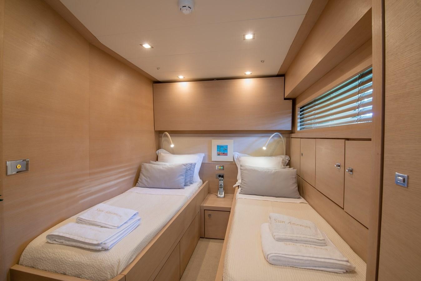 a room with a bed and a desk aboard SUN ANEMOS Yacht for Sale